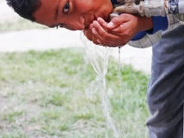 A child with clean water at the home