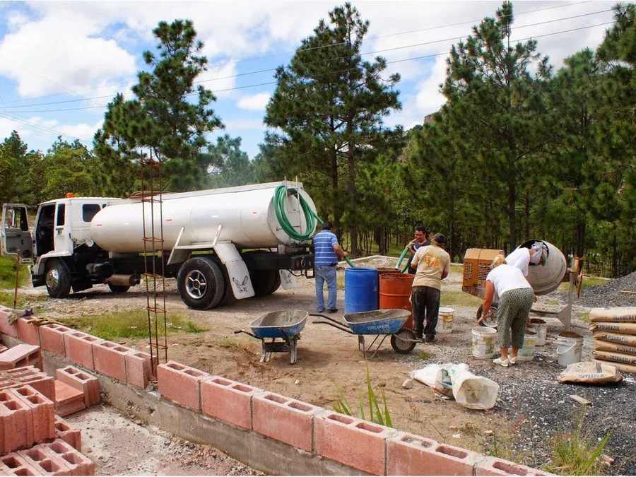 A water truck delivering water to the site during the build-out